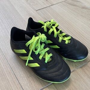 Adidas Black and Green soccer cleats with Sleek Design
